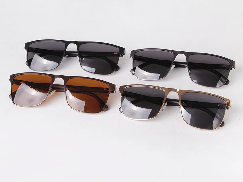 four pairs of sunglasses sitting next to each other