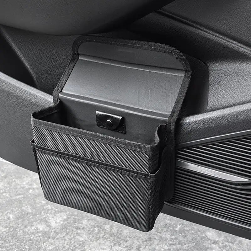 Compact Foldable Car Trash Bin with Magnetic Lid - Waterproof Backseat Organizer  

Transform your car's cleanliness with this innovative and versatile trash can. Its clever foldable design maximizes space and allows for easy storage when not in use. The