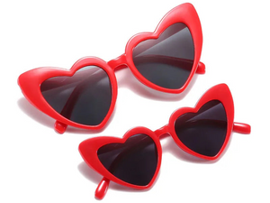 three heart shaped sunglasses on a white background