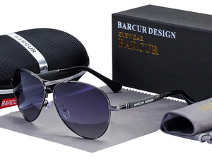 a pair of sunglasses sitting next to a case