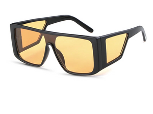 a pair of sunglasses with a yellow lens