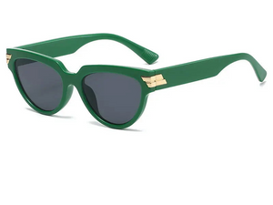 a pair of green sunglasses on a white background